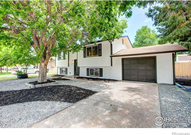 1206 Dawn Ave, Gilcrest, CO 80623 - raised ranch with an attached garage and concrete driveway