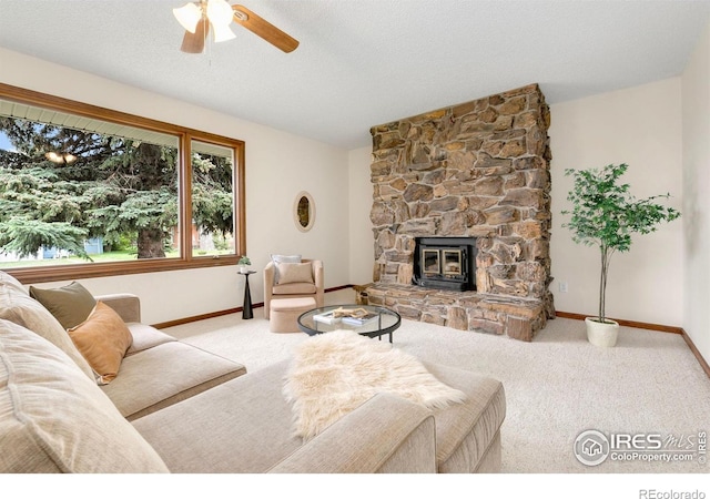 609 Endicott St, Fort Collins, CO 80524 - carpeted living area with ceiling fan and a stone fireplace