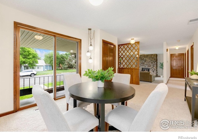 609 Endicott St, Fort Collins, CO 80524 - dining room with light carpet and a textured ceiling