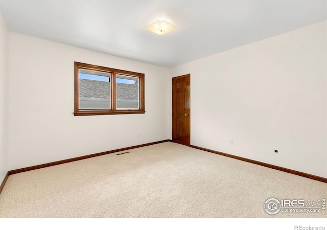 609 Endicott St, Fort Collins, CO 80524 - carpeted empty room with baseboards