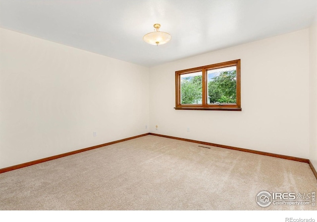 609 Endicott St, Fort Collins, CO 80524 - carpeted empty room featuring baseboards