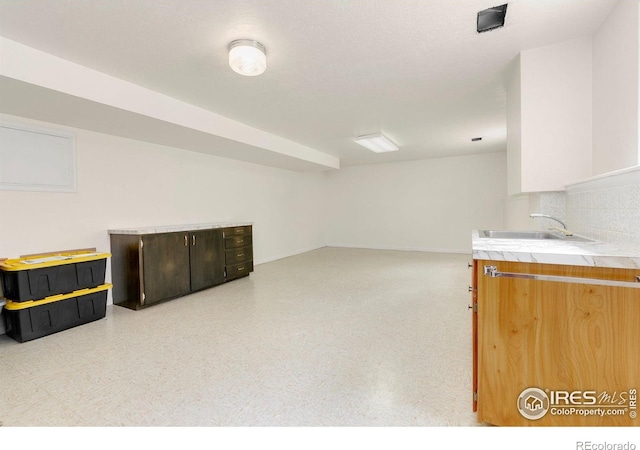 609 Endicott St, Fort Collins, CO 80524 - kitchen featuring tile counters and tasteful backsplash
