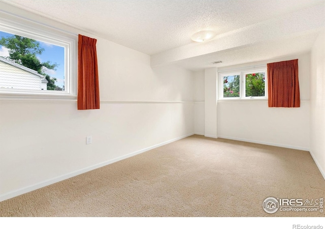 609 Endicott St, Fort Collins, CO 80524 - carpeted spare room with baseboards and a textured ceiling