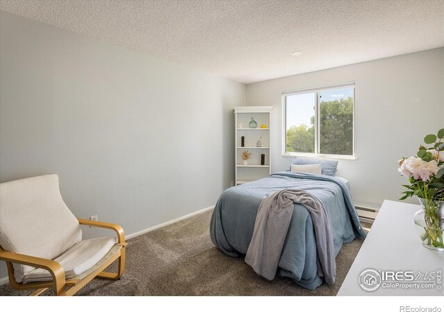 322 W Harper St, Louisville, CO 80027 - bedroom with carpet flooring, a baseboard heating unit, and a textured ceiling