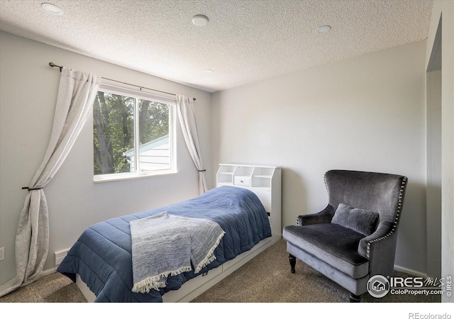 322 W Harper St, Louisville, CO 80027 - carpeted bedroom featuring a textured ceiling and baseboards
