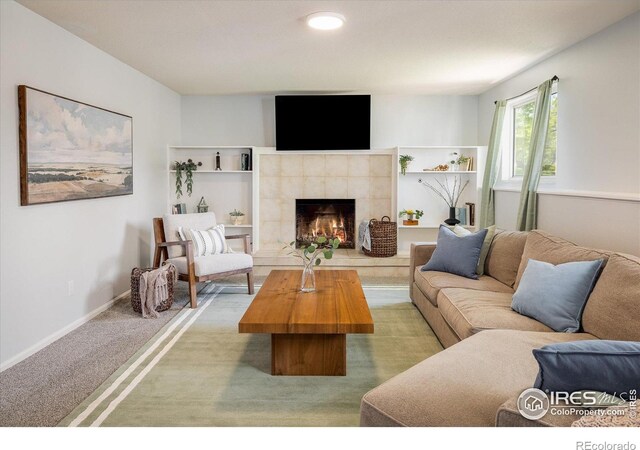 322 W Harper St, Louisville, CO 80027 - living area with carpet flooring, a tiled fireplace, and recessed lighting