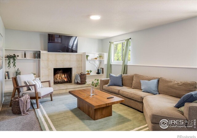 322 W Harper St, Louisville, CO 80027 - living area with a tiled fireplace and carpet