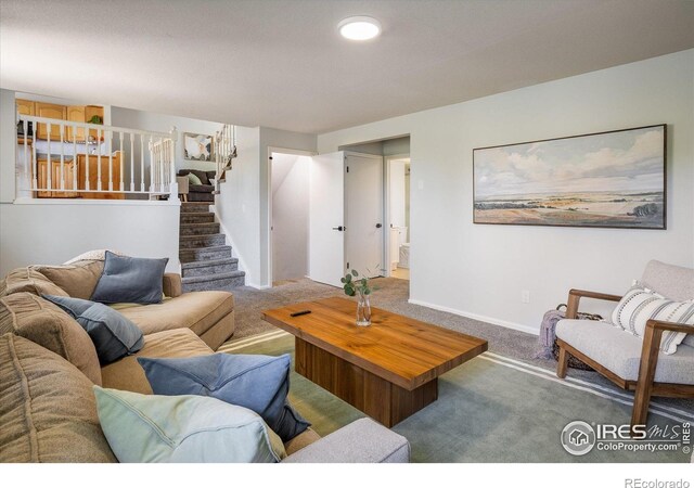 322 W Harper St, Louisville, CO 80027 - living room featuring carpet floors and stairway