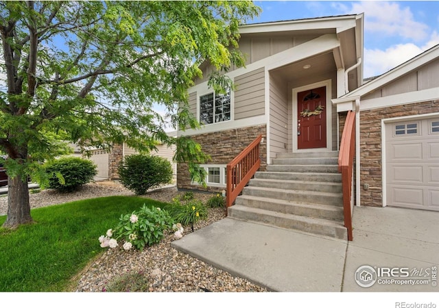 1879 Gemini Ct, Loveland, CO 80537 - doorway to property with stone siding and board and batten siding