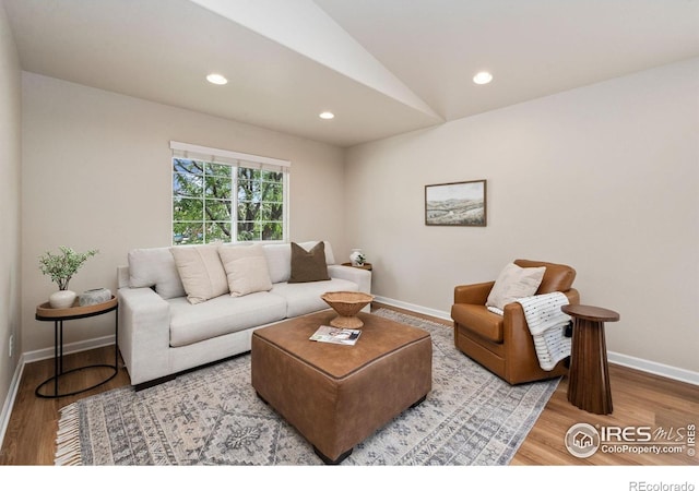 1879 Gemini Ct, Loveland, CO 80537 - living area featuring vaulted ceiling, wood finished floors, and recessed lighting