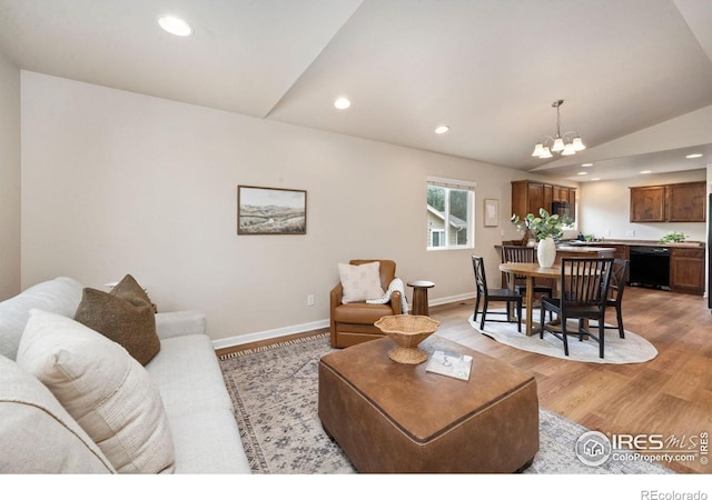 1879 Gemini Ct, Loveland, CO 80537 - living room with a chandelier, light wood finished floors, recessed lighting, and vaulted ceiling