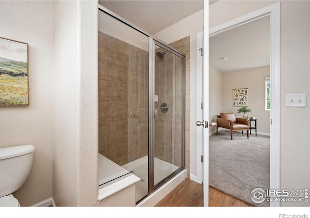 1879 Gemini Ct, Loveland, CO 80537 - full bathroom featuring a stall shower and wood finished floors