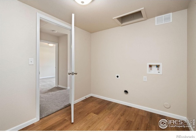 1879 Gemini Ct, Loveland, CO 80537 - laundry room featuring washer hookup, wood finished floors, gas dryer hookup, and hookup for an electric dryer