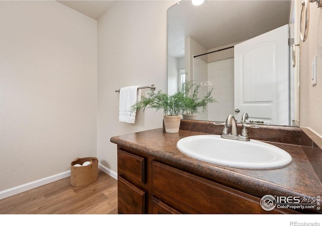 1879 Gemini Ct, Loveland, CO 80537 - bathroom featuring vanity and wood finished floors