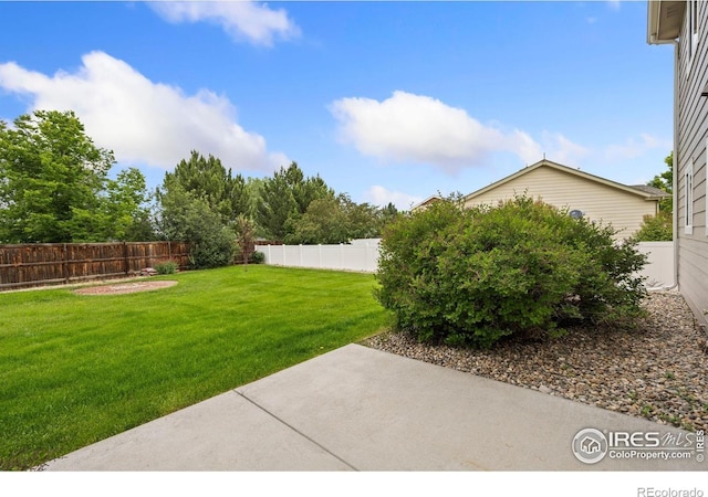 1879 Gemini Ct, Loveland, CO 80537 - fenced backyard with a patio