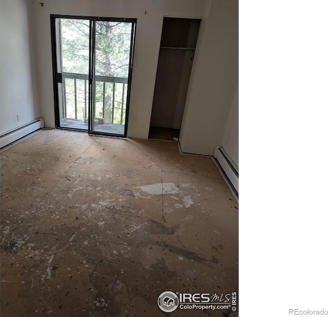 2919 Riverside Dr, Idaho Springs, CO 80452 - unfurnished bedroom with a baseboard heating unit