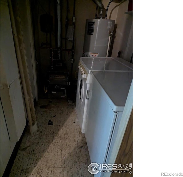 2919 Riverside Dr, Idaho Springs, CO 80452 - laundry area with independent washer and dryer, water heater, and a heating unit