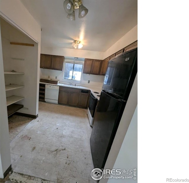 2919 Riverside Dr, Idaho Springs, CO 80452 - kitchen featuring dishwasher, freestanding refrigerator, range with electric cooktop, and light countertops