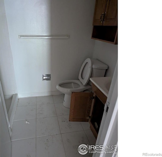 2919 Riverside Dr, Idaho Springs, CO 80452 - bathroom with vanity and tile patterned flooring