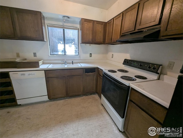 2919 Riverside Dr, Idaho Springs, CO 80452 - kitchen featuring white appliances, under cabinet range hood, light countertops, and dark brown cabinets