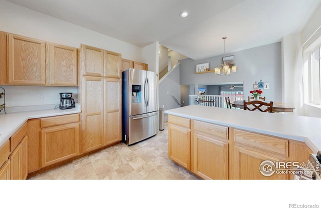 1661 Rise Dr, Windsor, CO 80550 - kitchen with stainless steel fridge with ice dispenser, light brown cabinets, plenty of natural light, and a chandelier