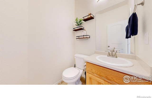 1661 Rise Dr, Windsor, CO 80550 - half bathroom featuring toilet and vanity
