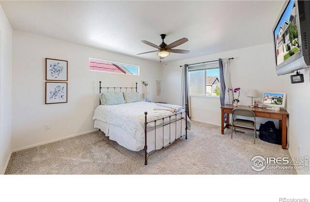 1661 Rise Dr, Windsor, CO 80550 - bedroom with light carpet, ceiling fan, and an office area