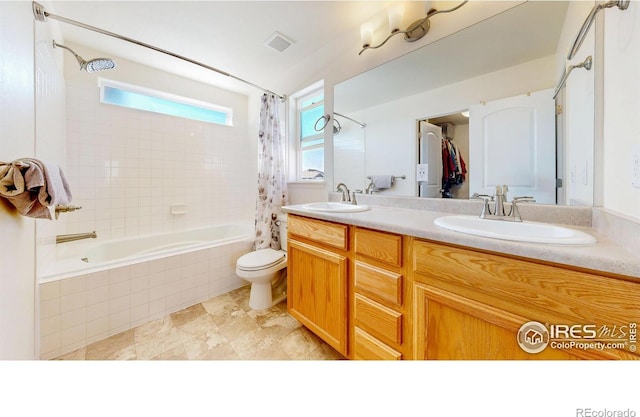 1661 Rise Dr, Windsor, CO 80550 - bathroom featuring tiled shower / bath, double vanity, and tile patterned flooring