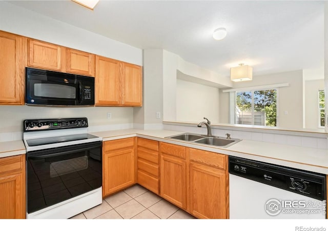 2120 Timber Creek Dr Unit 5, Fort Collins, CO 80528 - kitchen with black microwave, electric range oven, white dishwasher, light tile patterned floors, and light countertops
