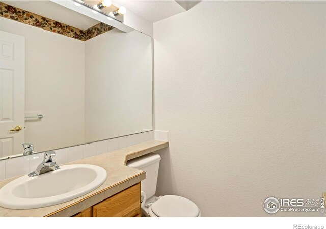 2120 Timber Creek Dr Unit 5, Fort Collins, CO 80528 - bathroom with toilet and vanity