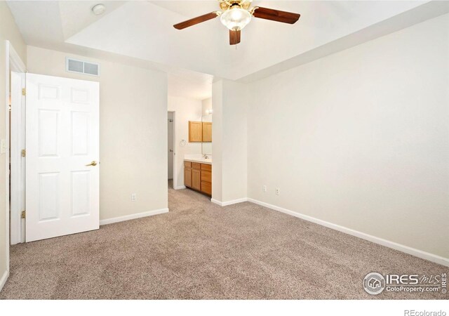 2120 Timber Creek Dr Unit 5, Fort Collins, CO 80528 - unfurnished bedroom with light colored carpet, ensuite bathroom, and ceiling fan