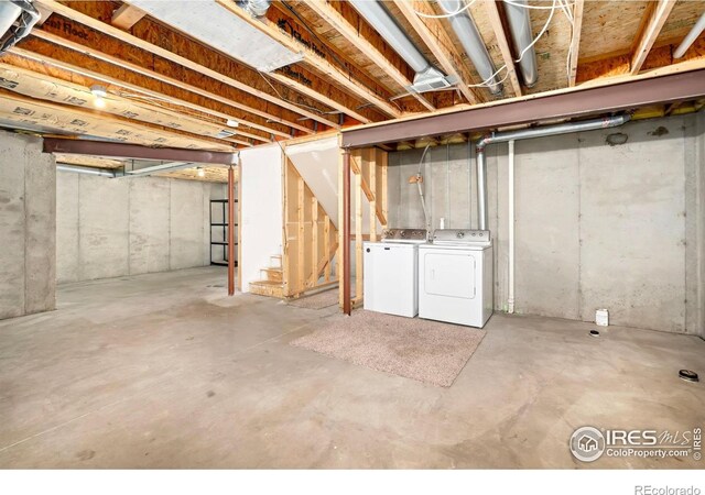 2120 Timber Creek Dr Unit 5, Fort Collins, CO 80528 - unfinished basement with washing machine and clothes dryer and stairway