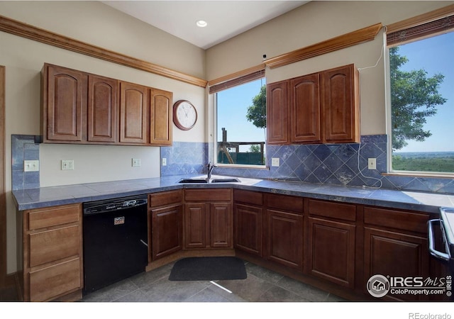 14448 Hanover St, Brighton, CO 80602 - kitchen featuring black dishwasher, dark countertops, decorative backsplash, healthy amount of natural light, and recessed lighting