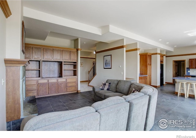 14448 Hanover St, Brighton, CO 80602 - living area featuring stairs, recessed lighting, and dark tile patterned floors