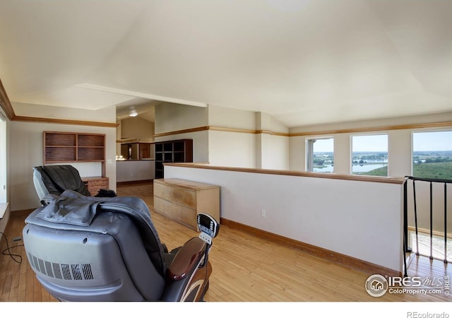14448 Hanover St, Brighton, CO 80602 - living room featuring light wood-style floors, plenty of natural light, and a water view