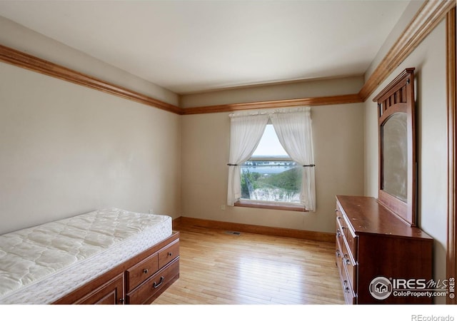 14448 Hanover St, Brighton, CO 80602 - bedroom featuring baseboards and light wood finished floors
