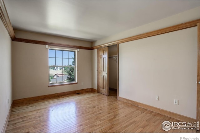 14448 Hanover St, Brighton, CO 80602 - unfurnished bedroom featuring light wood-type flooring and a closet
