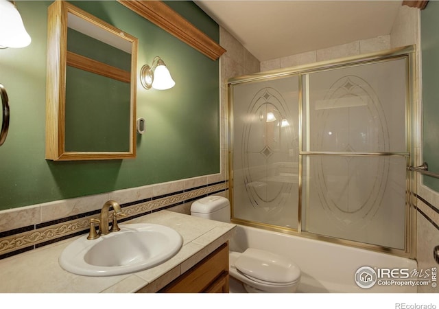 14448 Hanover St, Brighton, CO 80602 - bathroom featuring vanity and bath / shower combo with glass door