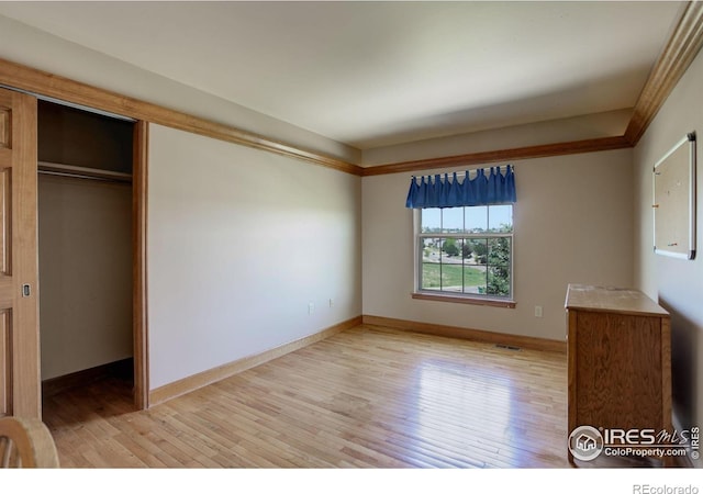 14448 Hanover St, Brighton, CO 80602 - unfurnished bedroom with light wood-type flooring and a closet