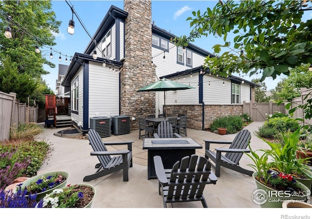 1043 Terrace Cir S, Boulder, CO 80304 - fenced backyard with a fire pit, a gate, and a patio area