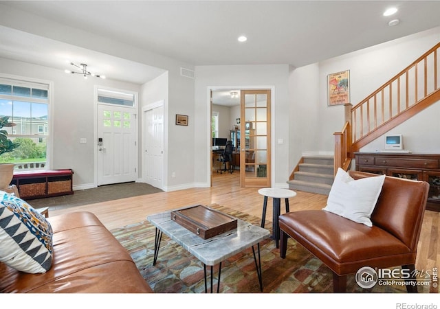 1043 Terrace Cir S, Boulder, CO 80304 - living room with stairs, recessed lighting, wood finished floors, a desk, and french doors