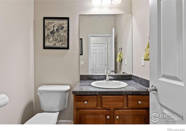 1043 Terrace Cir S, Boulder, CO 80304 - bathroom featuring vanity and a textured wall