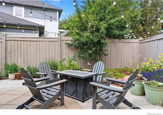 1043 Terrace Cir S, Boulder, CO 80304 - fenced backyard with a fire pit and a patio area