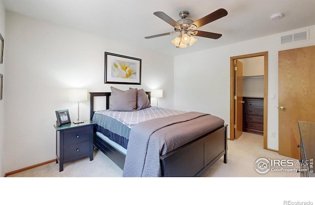 13673 Cook St, Thornton, CO 80602 - bedroom featuring light colored carpet, a walk in closet, and ceiling fan
