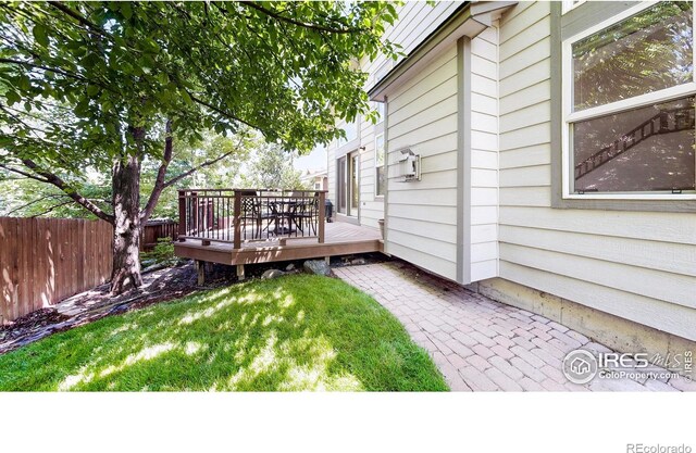 13673 Cook St, Thornton, CO 80602 - view of yard featuring a wooden deck and a patio
