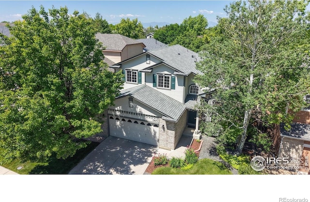 13673 Cook St, Thornton, CO 80602 - view of front of house with concrete driveway, a garage, and roof with shingles