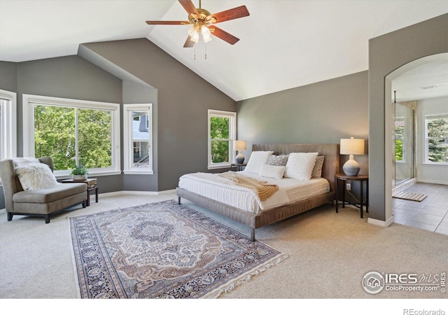 3931 Stonegrass Pt, Broomfield, CO 80023 - carpeted bedroom featuring arched walkways, vaulted ceiling, and ceiling fan
