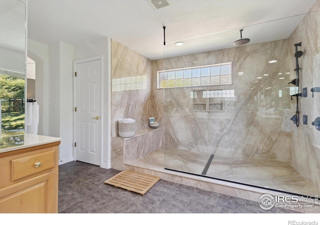 3931 Stonegrass Pt, Broomfield, CO 80023 - bathroom with healthy amount of natural light, a marble finish shower, and vanity