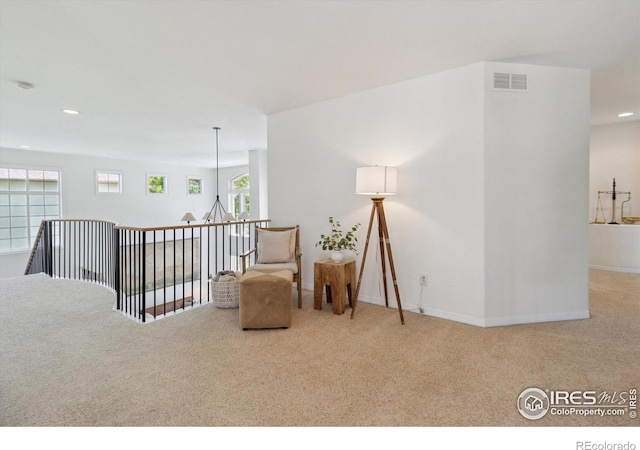 3931 Stonegrass Pt, Broomfield, CO 80023 - living area featuring carpet, recessed lighting, a chandelier, and an upstairs landing