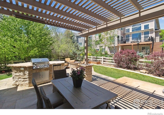 3931 Stonegrass Pt, Broomfield, CO 80023 - view of patio with an outdoor kitchen, outdoor dining space, and a pergola